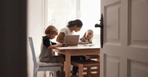 Mum and boy and girl doing homework
